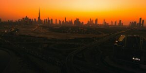 an aerial view of a city at sunset