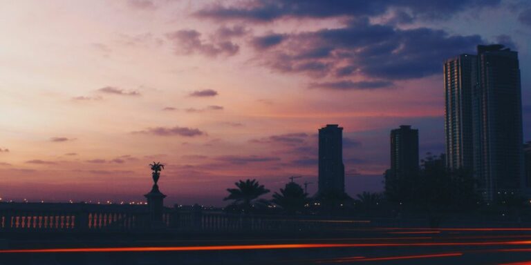 silhouette photography of high-rise buildings