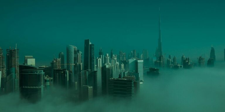 city skyline under blue sky during daytime