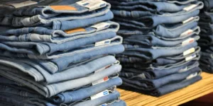 pile of blue denim jeans lot