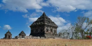 a large stone structure in the middle of a field