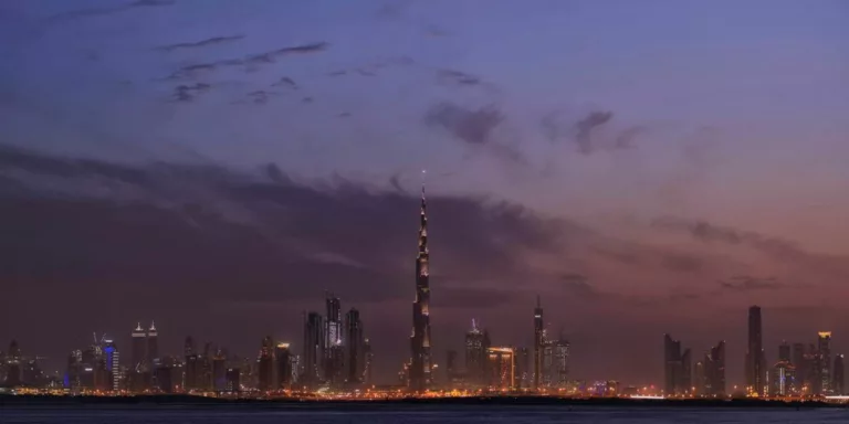 a view of a city at night from across the water