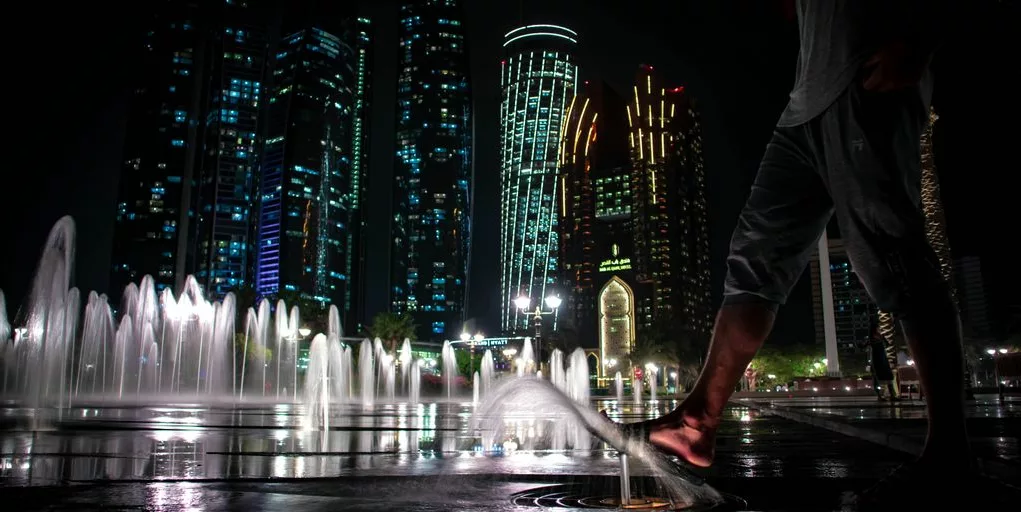 water fountain in front of building during nighttime