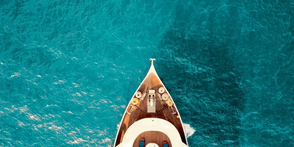 birds eye photography of boat on body of water