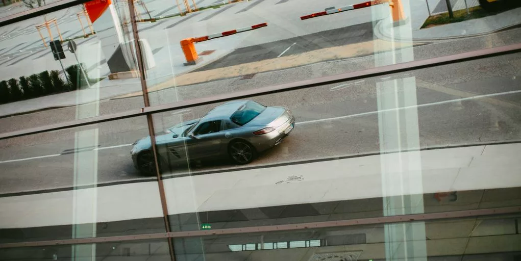 black sedan on road during daytime