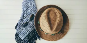 brown hat beside black handkerchief