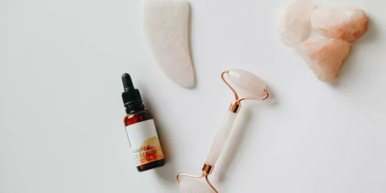 white and black plastic bottle beside white heart shaped ornament