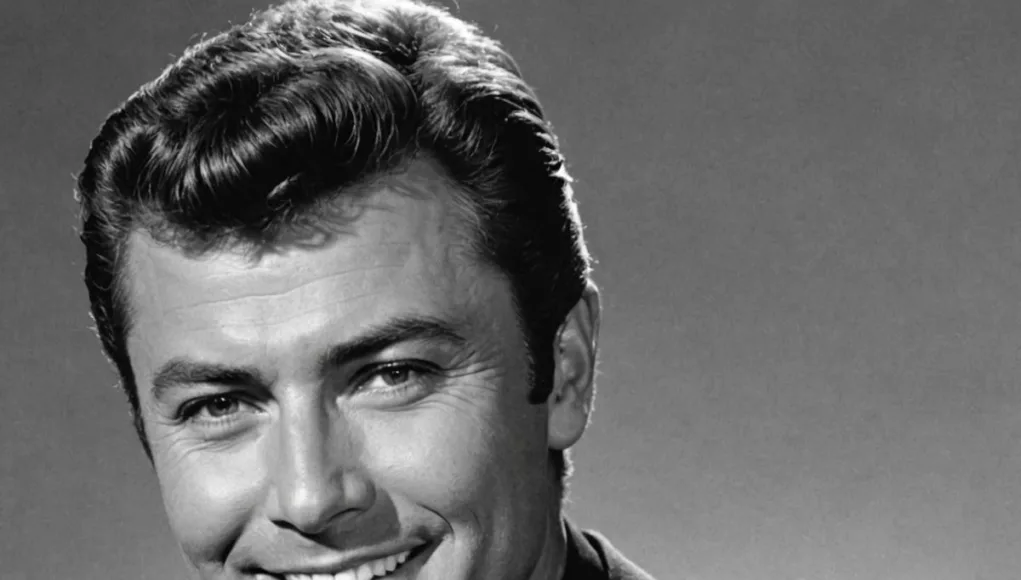 James Darren smiling in a black and white portrait.