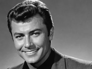 James Darren smiling in a black and white portrait.