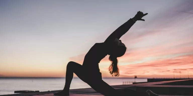 silhouette photography of woman doing yoga