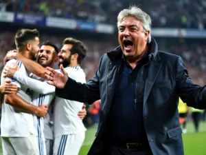 Carlo Ancelotti celebrating with Real Madrid players after victory.