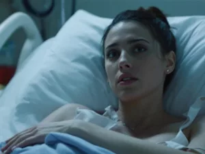 Halsey in a hospital bed, looking contemplative.