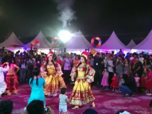 Traditional dancers in colorful costumes at Awafi Festival.