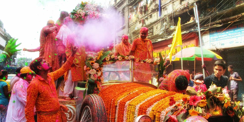 a group of people in clothing on a parade float