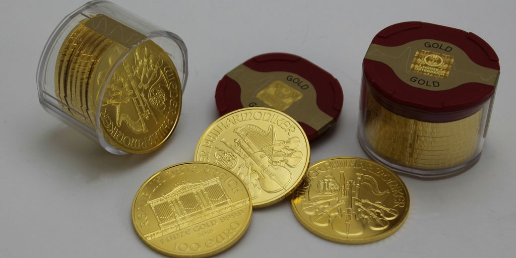 gold round coins on white surface
