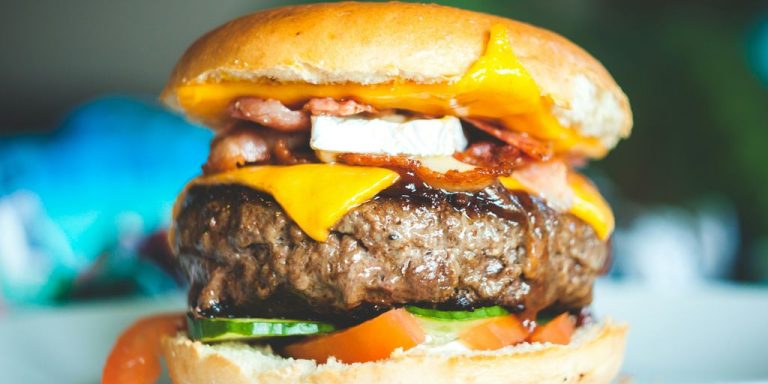 close-up photography of burger with patty and slice cheese