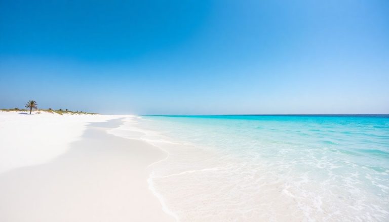 Sunny UAE beach, azure water, white sand, clear sky.